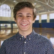 Smiling teen boy with medium brown hair